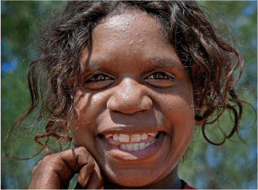 a photo of an Alyawarran child smiling