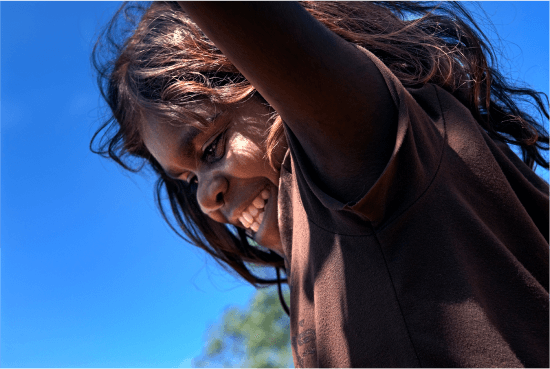 a photo of an Alyawarran child smiling