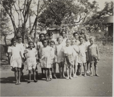 A black and white image of a group of children