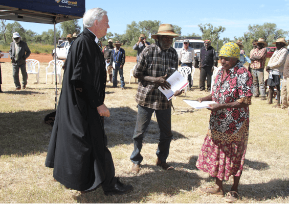 A photo of Banjo receiving the Native Title document for Ooratippra